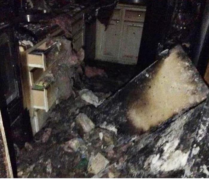debris burned kitchen, drawers of cabinets opened, damaged