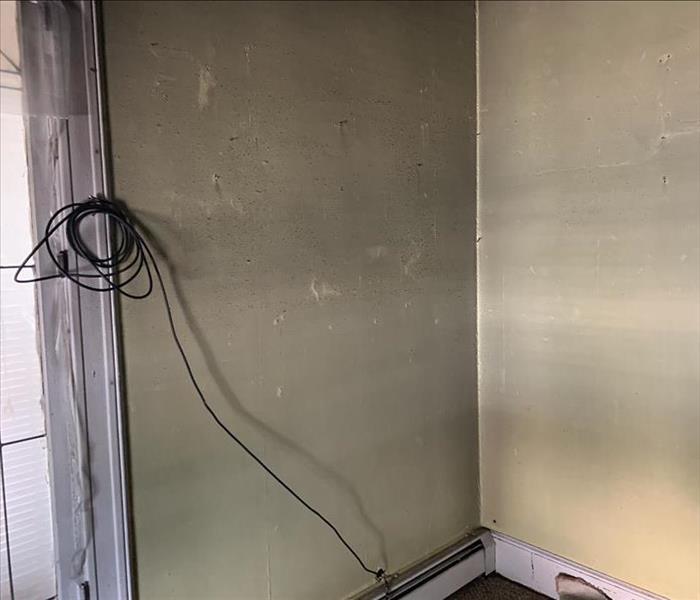 dirty, soot covered walls after a fire