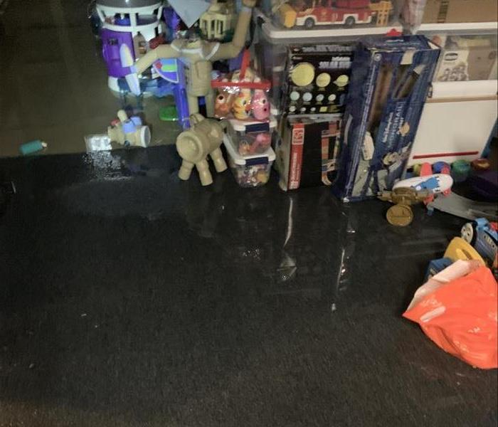 water soaking toys in a bedroom on shelf